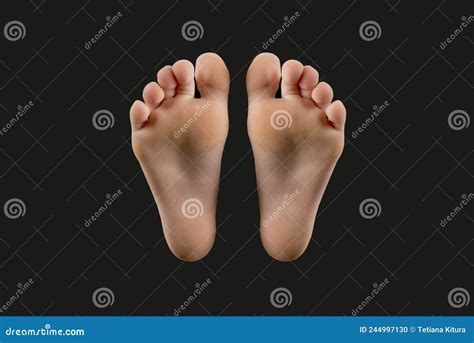 Two feet isolated on black stock photo. Image of foot - 244997130