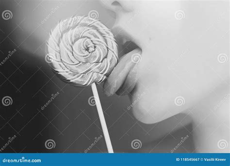 seductive female licking lollipop stock image image  candy face