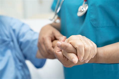 doctor holding touching hands asian senior  elderly  lady woman