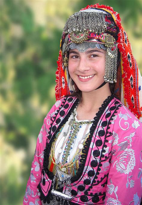 A Turkish folk dancer in a festive dress. | Turkish clothing