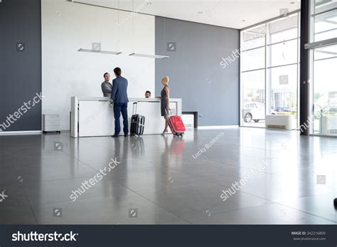 passengers departing business trip hotel reception stock photo edit