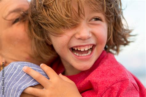 smiling 5 year old boy at the beach Stock Photo | Adobe Stock