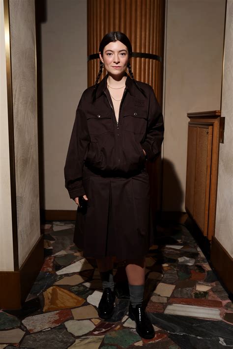 Lorde poses topless in thong in hotel bedroom before sending fans into