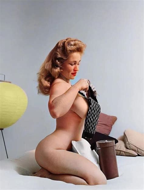 Virginia Bell checking out a tiny piece of fabric - Vintage Sexy Ladies