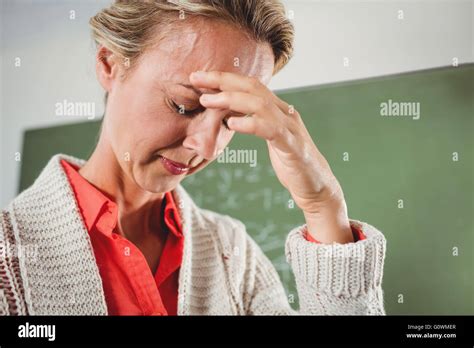 Sad teacher in front of blackboard Stock Photo - Alamy