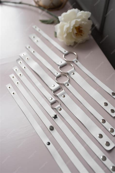Premium Photo | White leather fetish collars in different sizes fetish