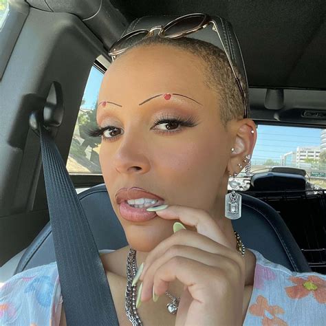 Doja Cat slams critics of her shaved head: 'Go f—k yourselves'