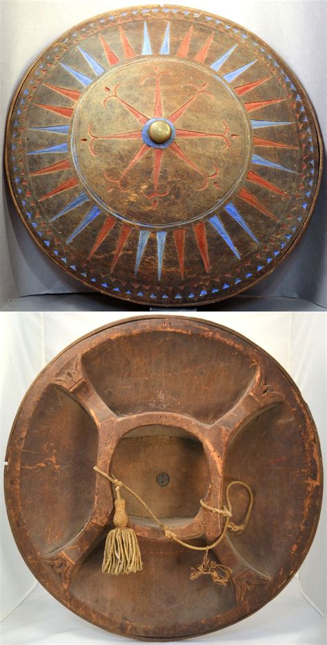 Moro (Philippines) circular wood shield. Carved from a single piece of