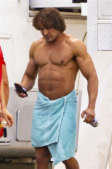 Zac Efron is unrecognizable with beefed up physique, bowl haircut