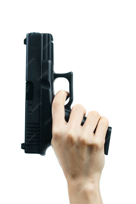 premium photo hand holding gun