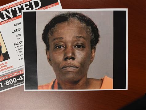 Suspects in shooting of Flint dollar store guard at large