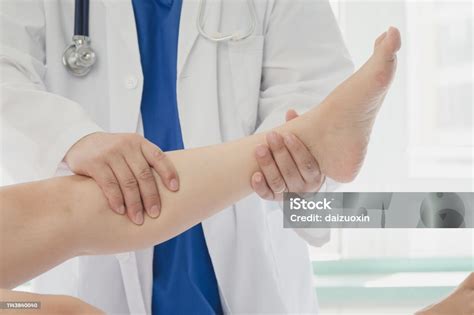 doctor giving  patient  leg treatment stock photo  image