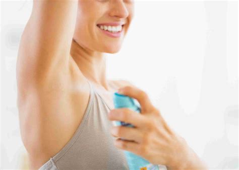 Closeup On Young Woman Applying Deodorant On Underarm - KinesiologyZone