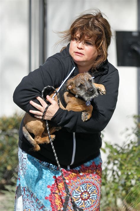 Ex-Baywatch babe Yasmine Bleeth, 51, smiles as she walks dog 17 years