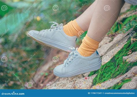 Person Wearing White Plimsoll Shoes Picture. Image: 119611341