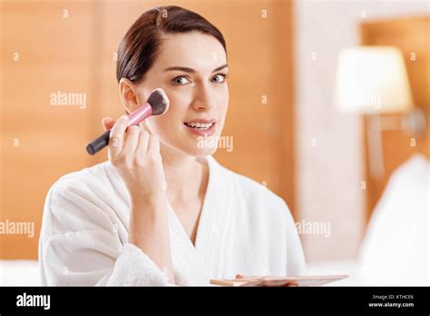 woman applying powder  res stock photography  images alamy