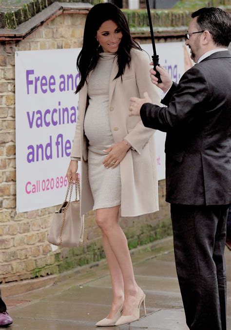Best 13 Meghan Markle Cradles Baby Bump Outside Her Baby Shower in New