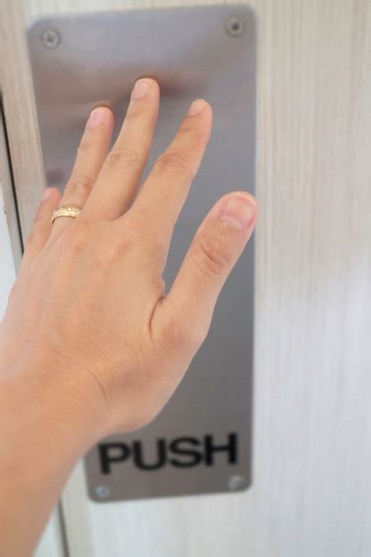 premium photo woman hand pushing  door