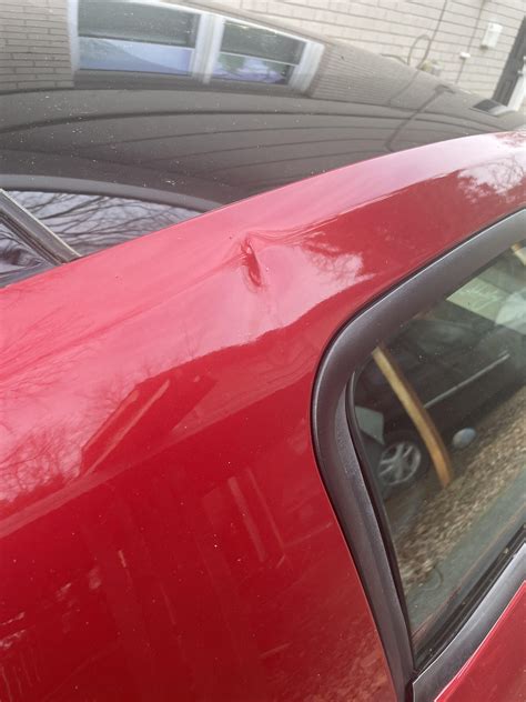 Neighbors door fell on my car. How much would this take to get fixed