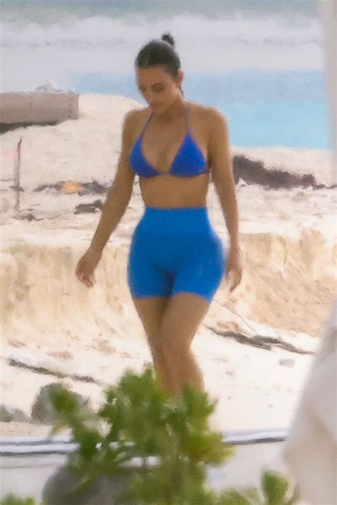 Kim Kardashian shows off her butt in blue bikini while paddleboarding