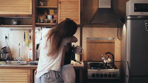 Female Couple Kissing Each Other in the Kitchen · Free Stock Video