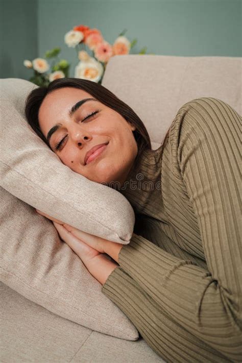 vertical sleeping caucasian young woman  nap   sofa