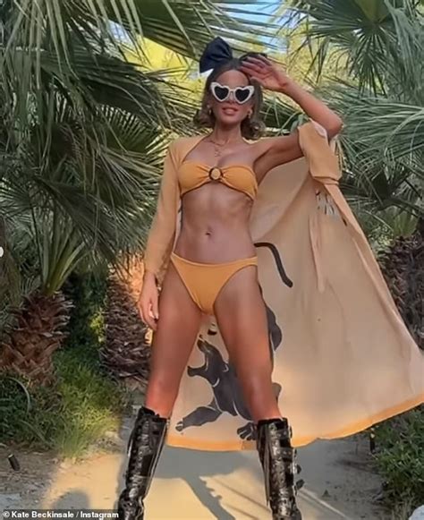 kate beckinsale turns   heat   shows   figure