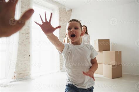 Playful mood from the kid. Family have removal into new house