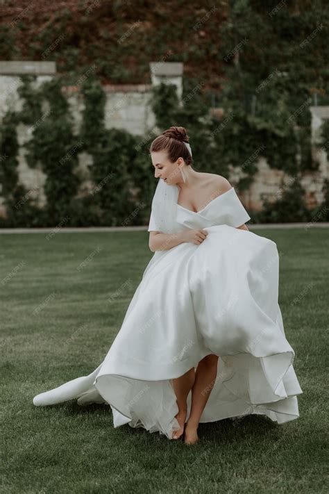 Premium Photo | Portrait of beautiful bride in beige wedding dress with