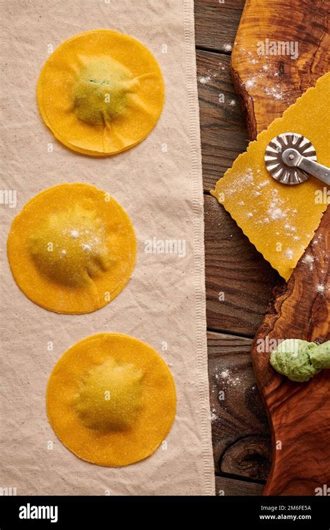 Raw homemade ravioli pasta with spinach and ricotta Stock Photo - Alamy