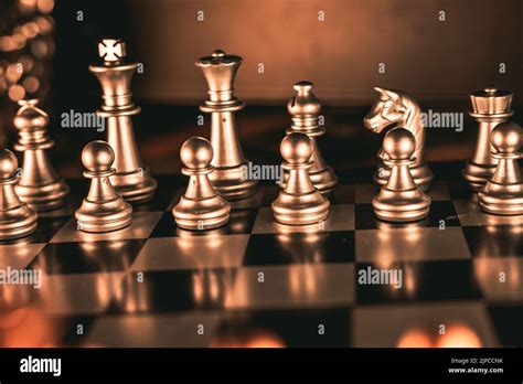 Silver chess pieces on the chessboard Stock Photo - Alamy