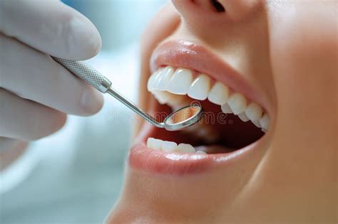 closeup  female patient  open mouth receiving dental treatment