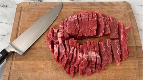 how to cut flank steak before cooking