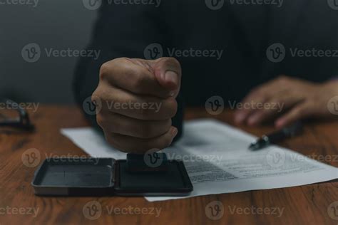 Hand man stamping documents notary public in office . Businessperson ...