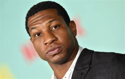 Jonathan Majors appears in court over assault charges, trial date set ...