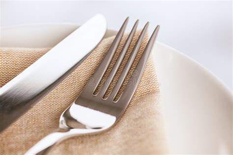 Fork and knife on napkin stock photo. Image of table - 133878928