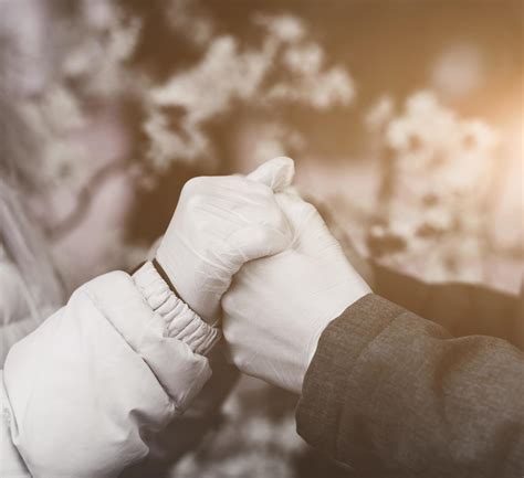 two lovers holding hands in gloves 11250717 Stock Photo at Vecteezy