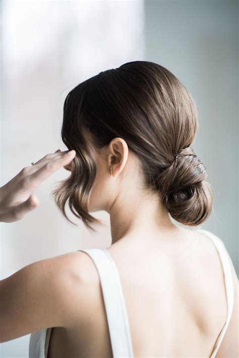 Modern simple low bun updo with bangs | Low bun wedding hair, Easy bun ...