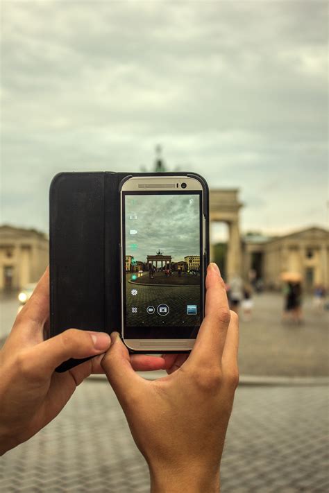 640x960 wallpaper | Person Taking Picture Using Gray Smartphone | Peakpx
