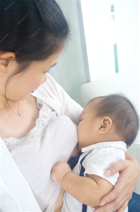 Premium Photo | Asian mother breastfeeding her baby boy
