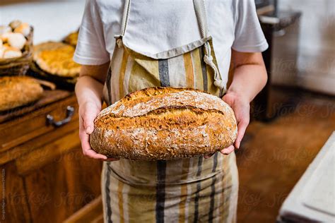 "Anonymous Baker Showing Beautiful Bread Loaf In A Bakery" by Stocksy ...