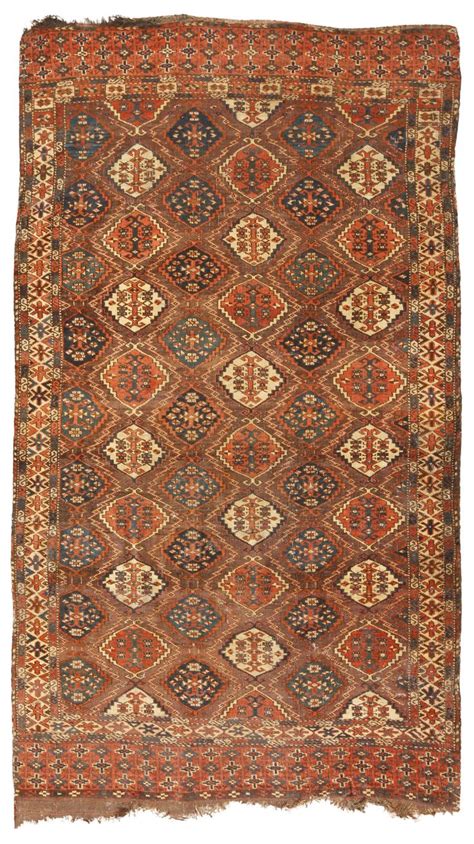 an old rug with many different colors and patterns