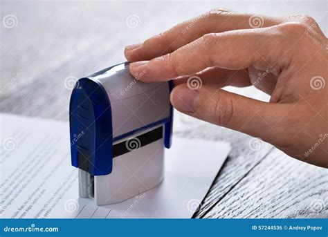 person hands  stamper  document stock photo image  business
