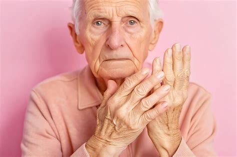 Senior person with trembling hands showing signs of neurological health ...