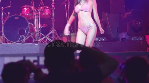 asian woman  pink lingerie dancing striptease   stage  night