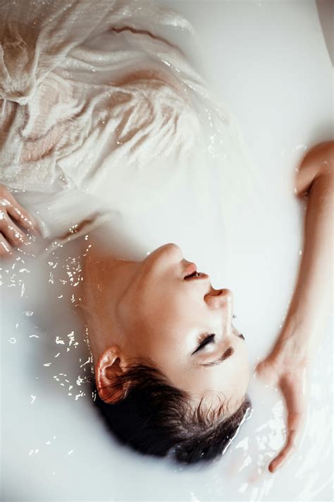 Woman Relaxing In A Tub Of Milk Bath · Free Stock Photo