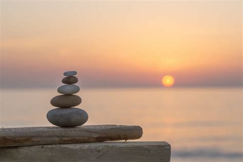 sunset rock balancing wallpaper happywall