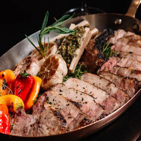 The double-bone pork chop is... - Fireplace Grill and Bar