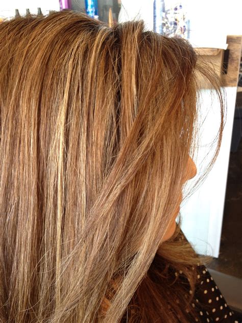 Light brown hair golden highlights create a stunning summer glow 3