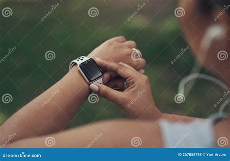 Keeping Track of My Steps. a Woman Using Her Smartwatch during a ...